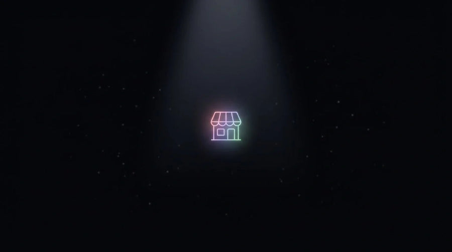 A single glowing storefront point drawn out of the dark by a converging beam of light, illustrating a store being surfaced by AI shopping on Black Friday
