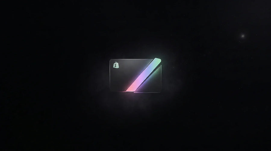 Dark payment card with a small glowing slice lifting away, illustrating the fee Shopify takes per sale