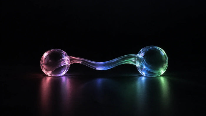 Two glass spheres joined by a flowing link, representing migrating Shopify subscriptions without losing subscribers